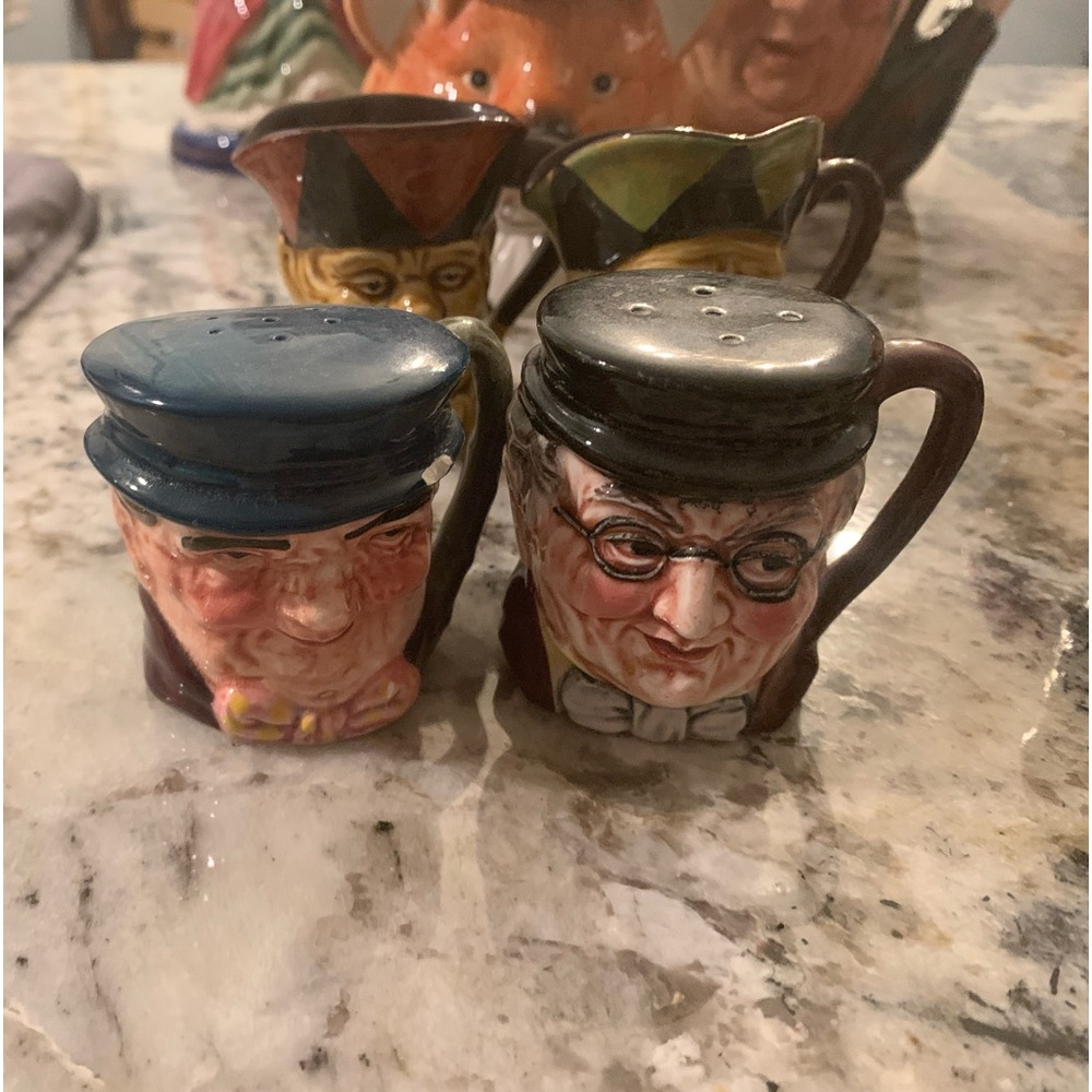 Different size mugs that are similar to Tobys. No markings on these.